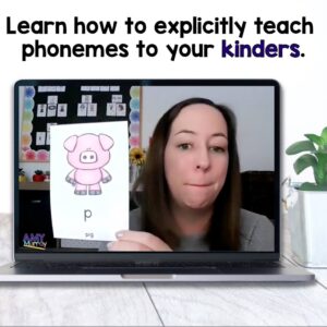 teacher on a computer screen holding up the p phoneme card