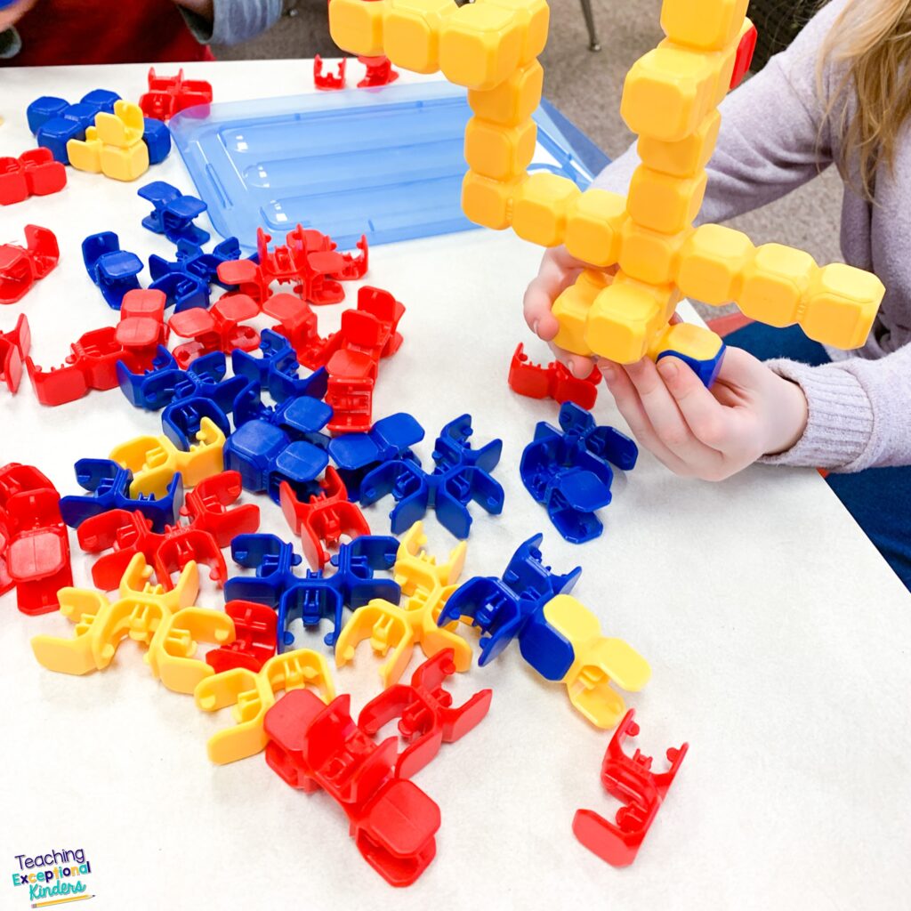 Student playing with stacking blocks in morning tub