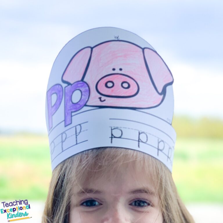Child wearing an alphabet hat for the letter P