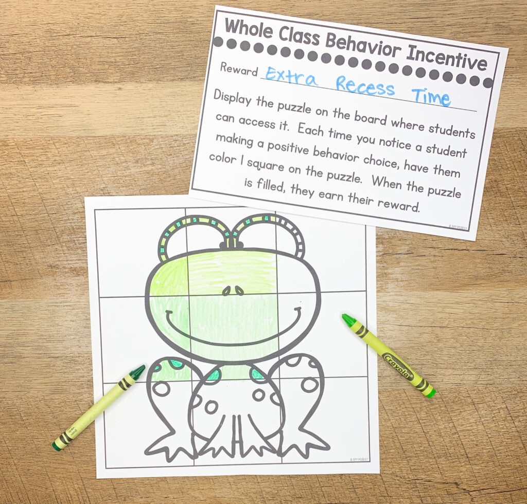 A frog behavior puzzle is being colored with crayon.
