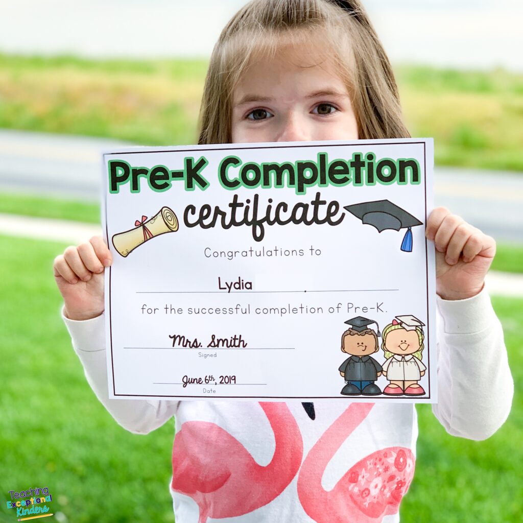Child Holding Pre-K Completion Certificate