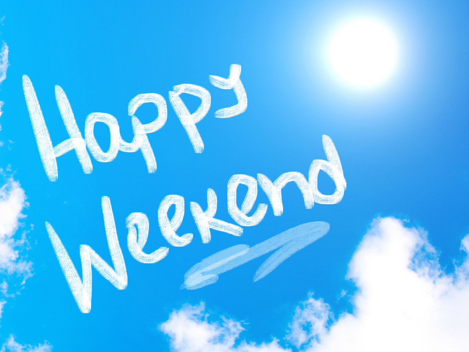 Sky writing in a blue sky "Happy Weekend"