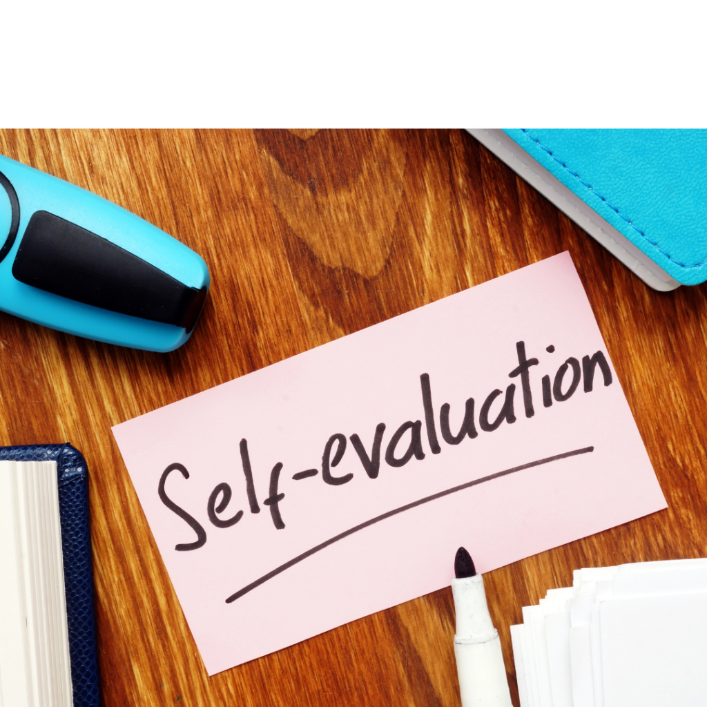 "Self-evaluation" written on a pink sticky note with black marker
