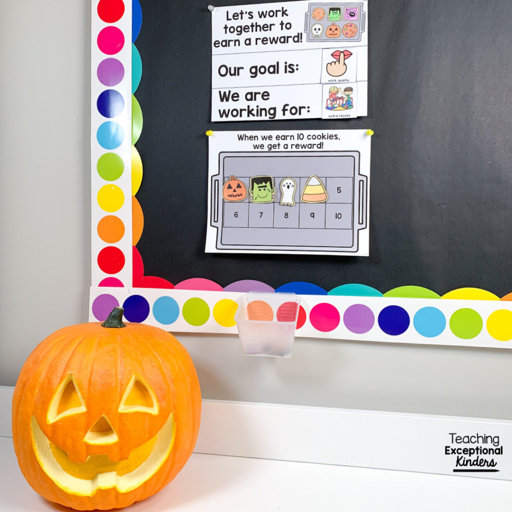 Pumpkin sits in front of bulletin board with visual supports
