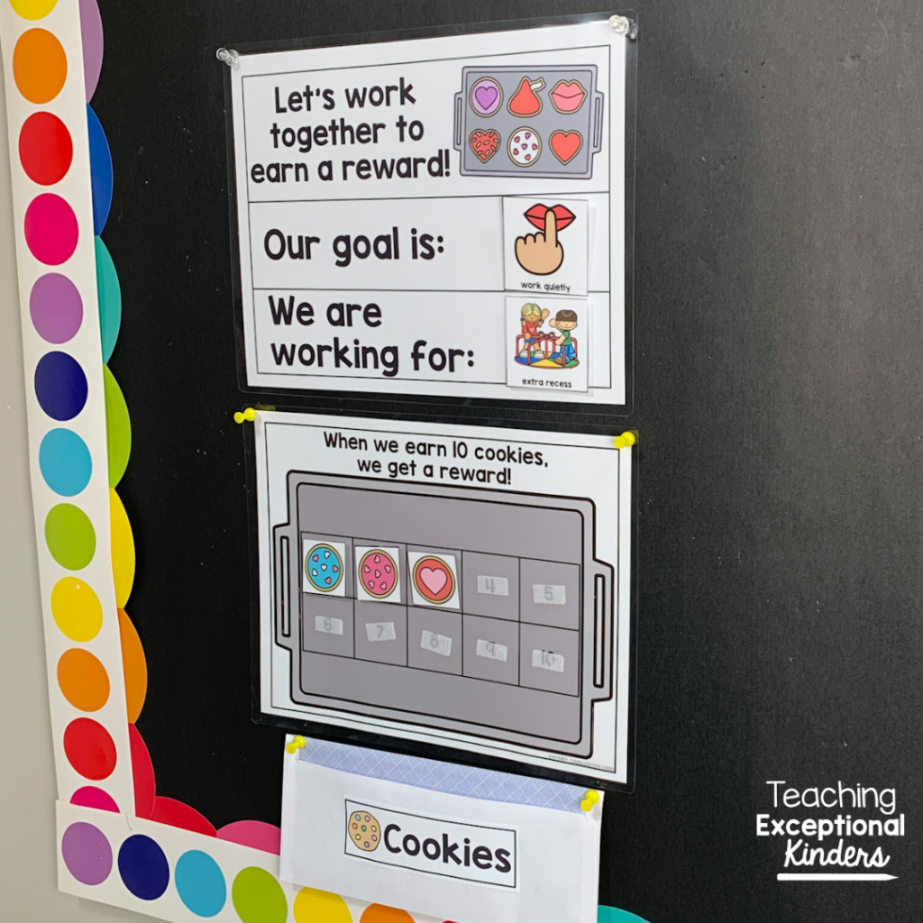 Valentine themed cookie sheet reward system on a bulletin board