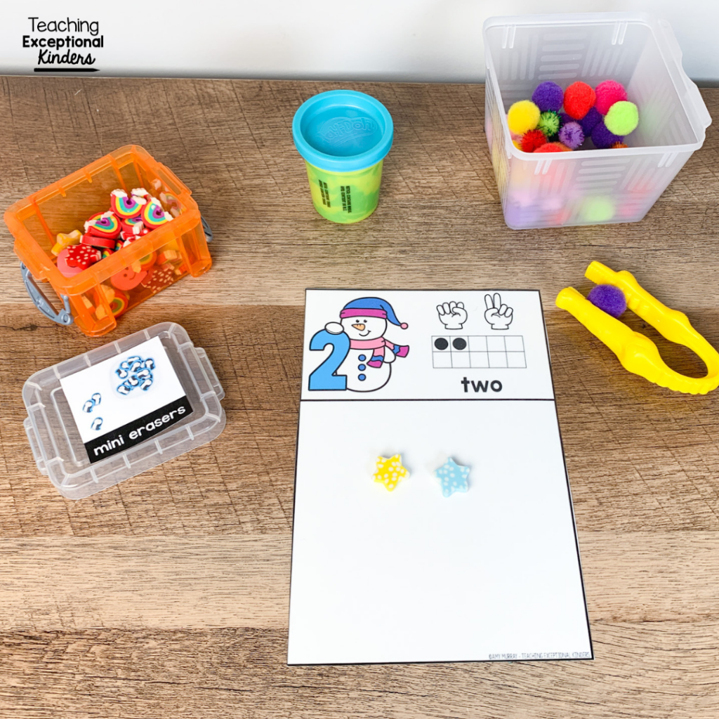 Play dough, pom poms, tweezers, and a counting task card